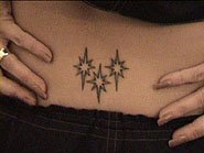 victoria beckham star tattoo lower back